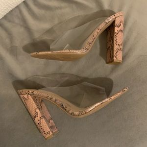 Clear snakeskin mules
